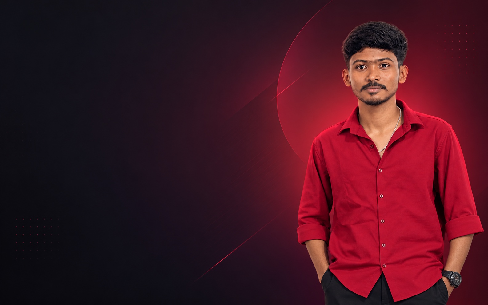 Manoj in a red shirt against a dark red background